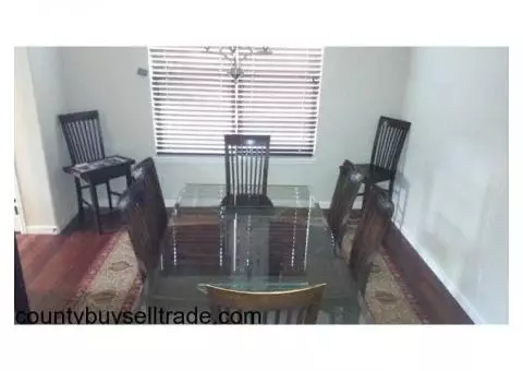 Glass dining table w/beveled edge and etched columns